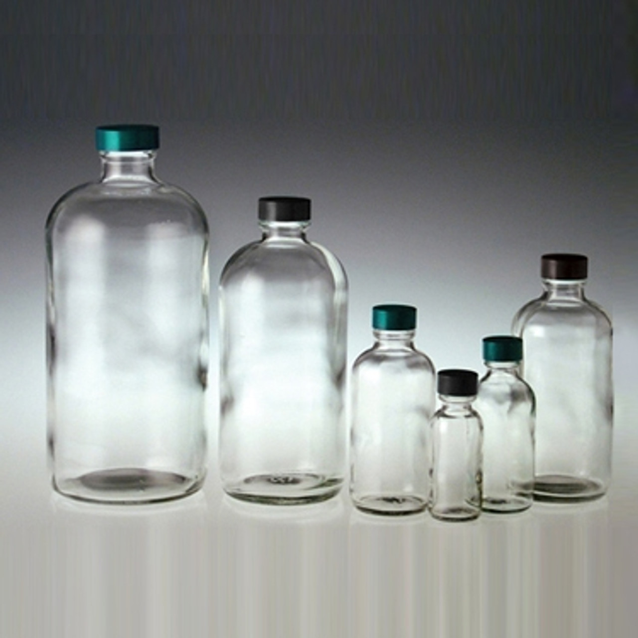 16oz Clear Glass Boston Round Bottles (Black Phenolic Cap) - 12/Case, Clear Type III 28-400