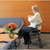 Triumph Mobility - Essentials Walker with seat #700-1000 with a sitting person