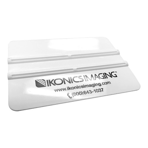 ikonics imaging plastic squeegee to apply sandcarving stencil mask