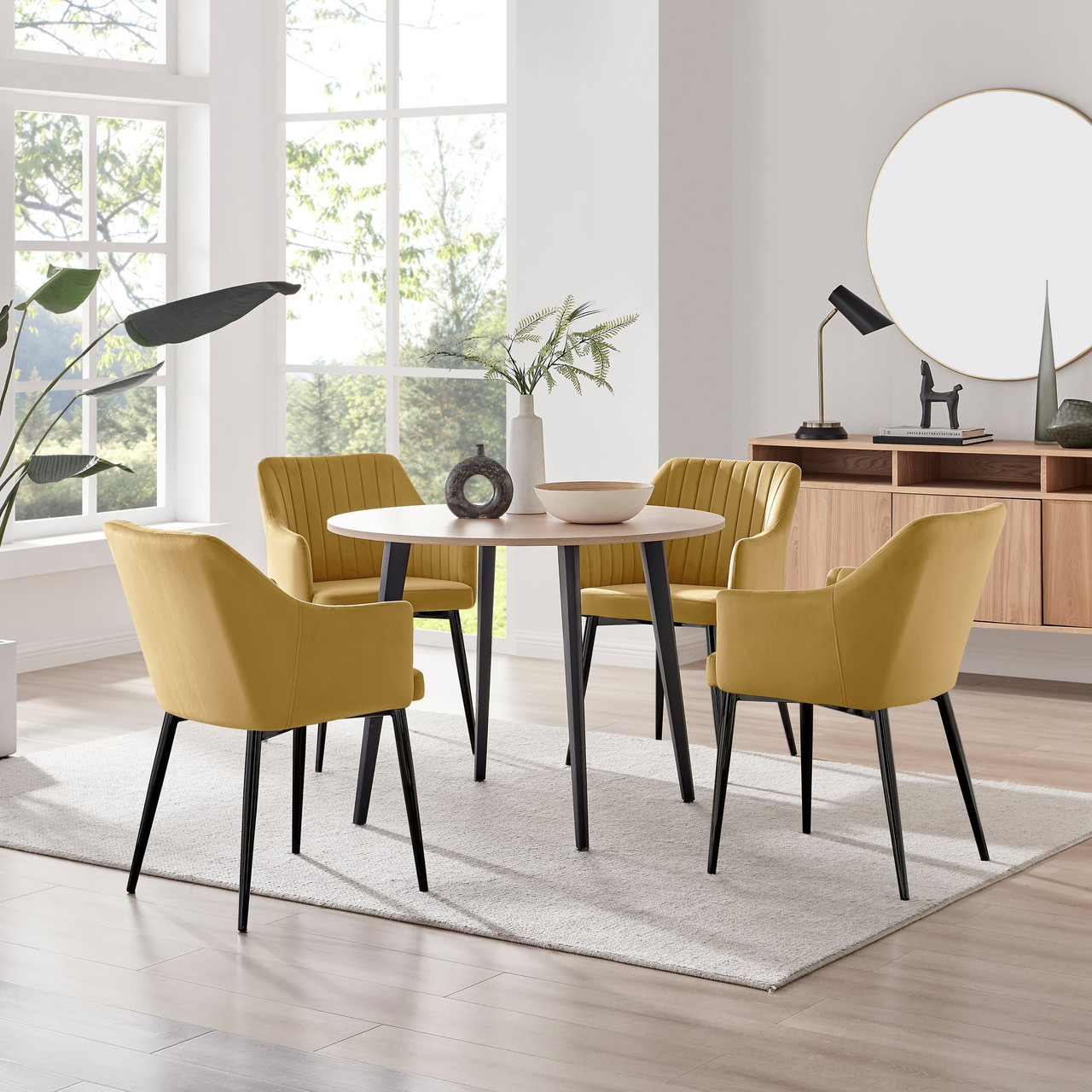 Koko Oak Effect Round Dining Table Calla Black Leg Chairs
