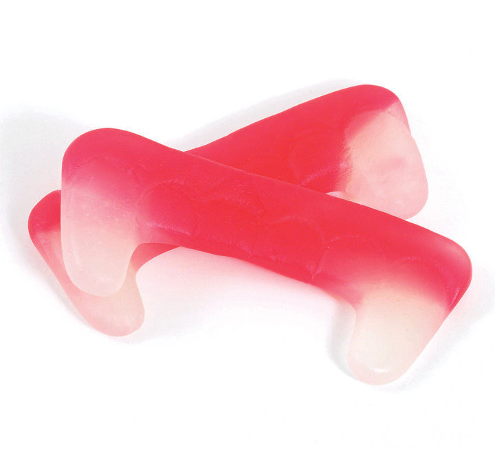 Dracula Teeth - These fruit flavoured chews are shaped as Draculas' teeth and fangs. 2.5" long they are a real mouth full and remain a top 10 bestseller all year round.