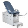 1000AX-XXDX-XXX-24 Brewer Company Versa Exam Table with Standard Upholstered Top included, Pneumatic/Manual Back, 500 lb. Weight Capacity, Pass-through Rear Drawer, 5 Year Warranty, and Seamless Upholstery in Black Satin