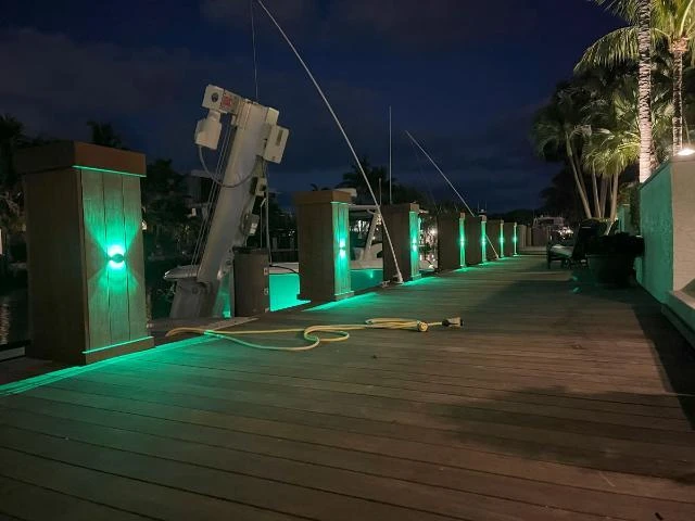 Lumitec Scallop lights installed vertically on pilings in Lighthouse Point
