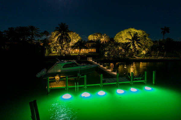 green underwater lights on dock