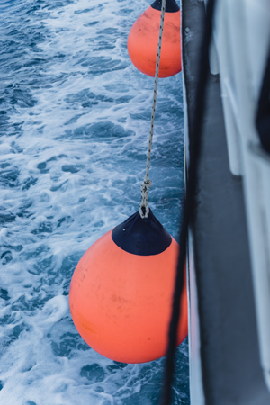 round fenders on a larger ship