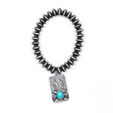 Faux Navajo Disc Pearl Stretch Bracelet with Thunderbird Charm