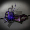 Masquerade mask with purple feathers and netting.