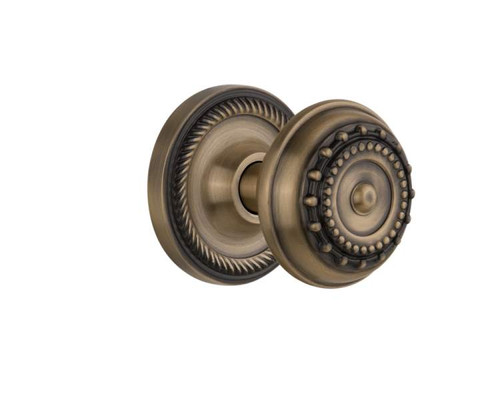 Nostalgic 702500: Rope Rosette w/Meadows Knob Privacy Door Set - Antique Brass
