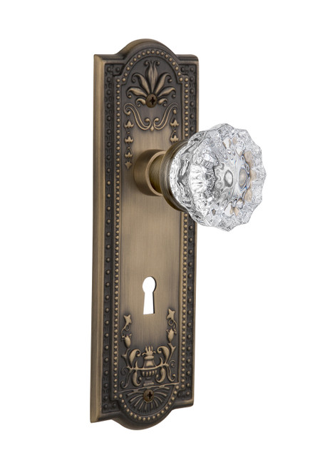 Nostalgic 701825: Meadows Backplate w/Clear Crystal Glass Knob Privacy Door Set - Antique Brass