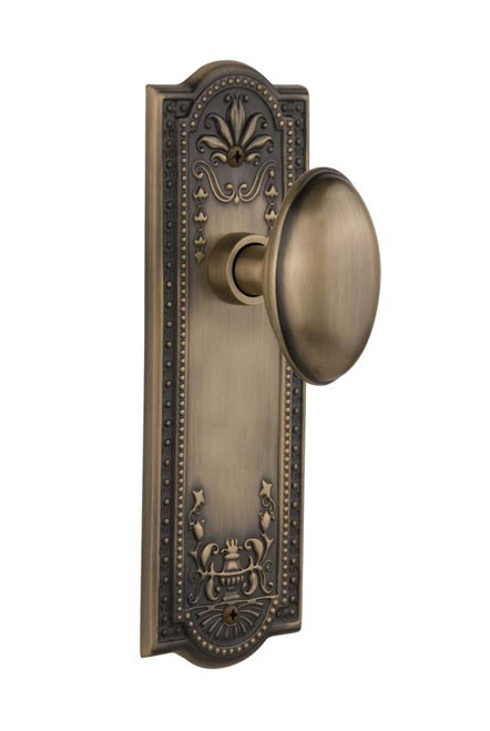 Nostalgic 704330: Meadows Backplate w/Homestead Knob Passage Door Set - Antique Brass