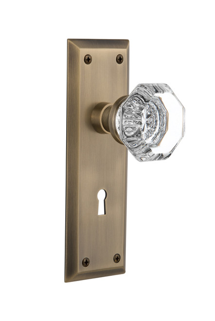 Nostalgic 704615: New York Backplate w/Waldorf Knob Passage Door Set - Antique Brass