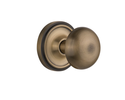 Nostalgic 704787: Classic Rosette w/New York Knob Passage Door Set - Antique Brass