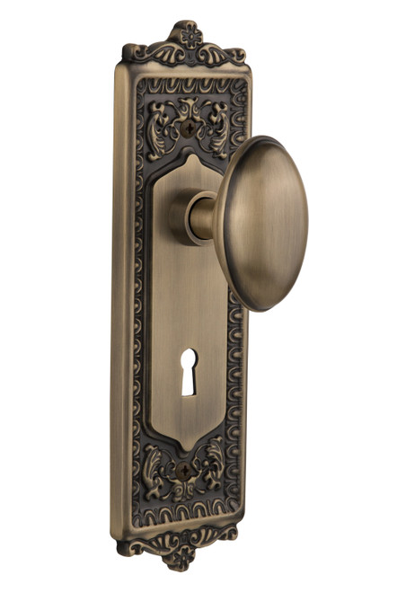 Nostalgic 704222: Egg & Dart Backplate w/Homestead Knob Single Dummy Door Set - Antique Brass