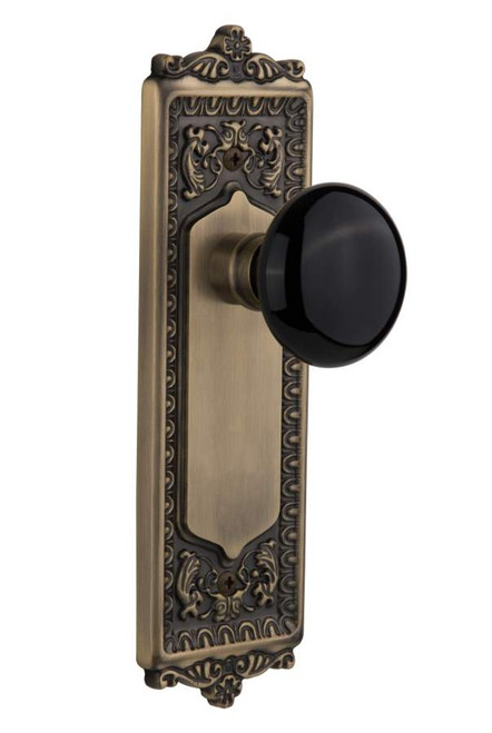 Nostalgic 710103: Egg & Dart Backplate w/Black Porcelain Knob Single Dummy Door Set - Antique Brass