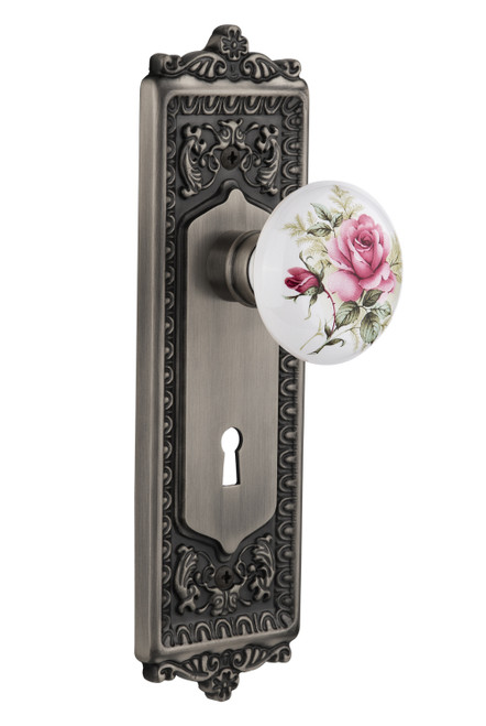 Nostalgic 711230: Egg & Dart Backplate w/White Rose Porcelain Knob Privacy Door Set - Antique Pewter