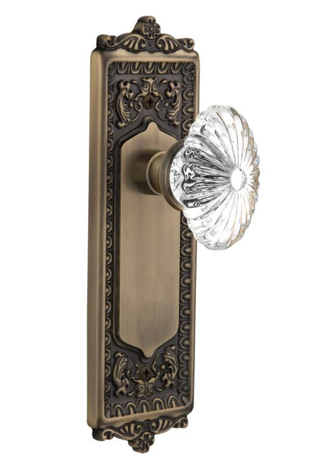 Nostalgic 711767: Egg & Dart Backplate w/Oval Fluted Clear Glass Crystal Knob Passage Door Set - Antique Brass