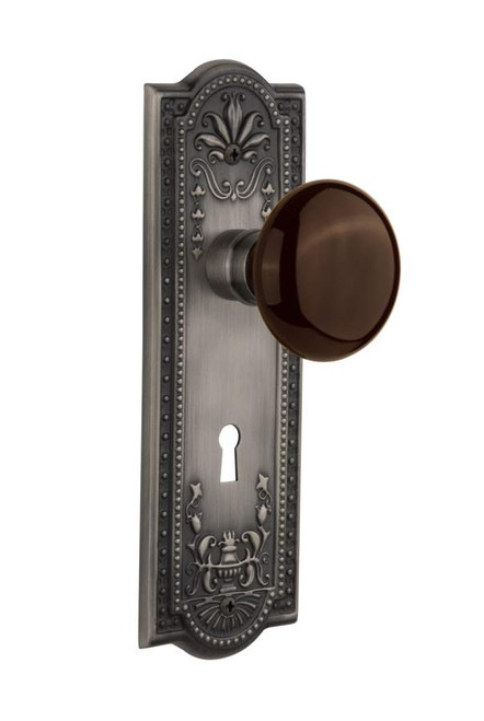 Nostalgic 710797: Meadows Backplate w/Brown Porcelain Knob Privacy Door Set - Antique Pewter