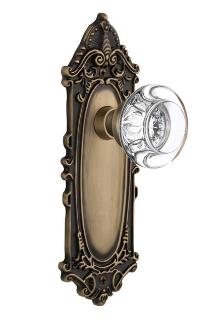 Nostalgic 712235: Victorian Backplate w/Round Clear Glass Crystal Knob Passage Door Set - Antique Brass