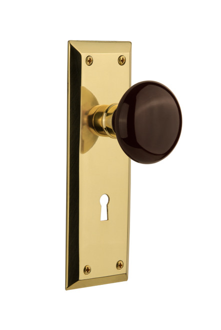 Nostalgic 710807: New York Backplate w/Brown Porcelain Knob Privacy Door Set - Polished Brass