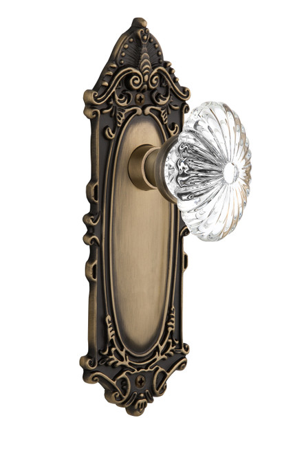 Nostalgic 711795: Victorian Backplate w/Oval Fluted Clear Glass Crystal Knob Passage Door Set - Antique Brass