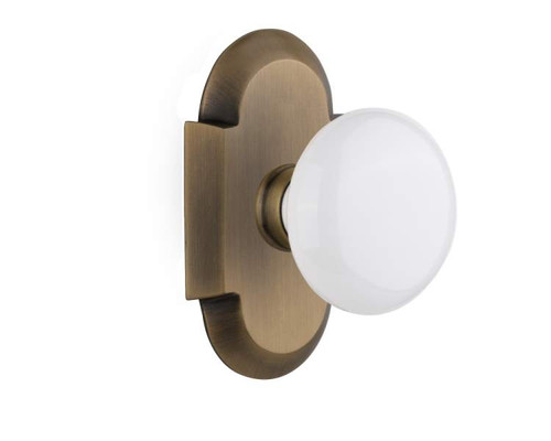 Nostalgic 713081: Cottage Backplate w/White Porcelain Knob Single Dummy Door Set - Antique Brass