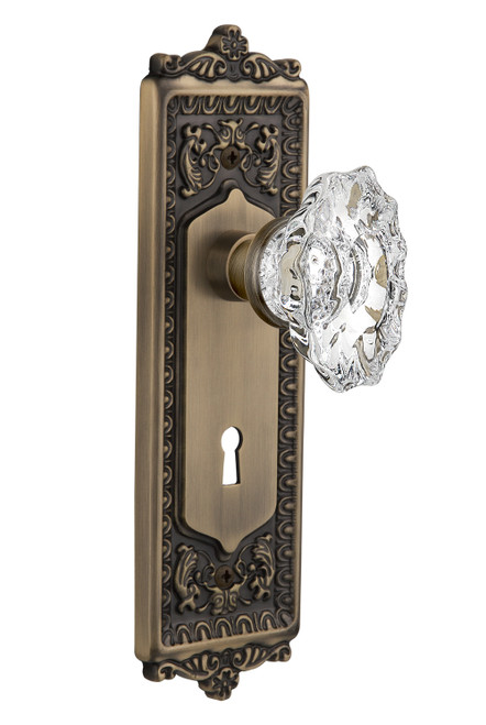 Nostalgic 713676: Egg & Dart Backplate w/Chateau Knob Passage Door Set - Antique Brass