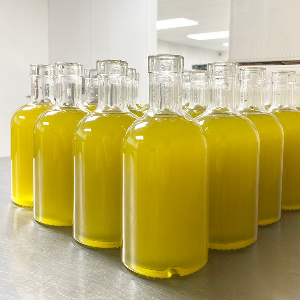 Our unfiltered 2023 Olio Nuovo bottling in process. Our unfiltered 2023 Olio Nuovo bottling in process.
