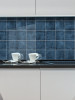 Marine blue peel and stick composite wall tiles installed as a kitchen splashback in a modern interior (300x300mm)