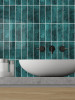 Peel and stick emerald green wall tiles installed in bathroom vanity area