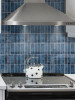 Marine blue rectangular wall tiles creating a bold feature wall in a modern interior
