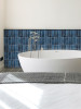 Marine blue rectangular self adhesive wall tiles used on a contemporary bathroom wall