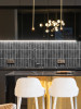 Modern kitchen with dark grey peel and stick rectangle wall tiles used as a stylish feature splashback