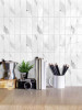 Calacatta white subway tiles in a vertical layout with marble effect finish