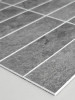 Dark charcoal grey vinyl wall tiles in a stacked brick pattern, ideal for a modern kitchen backsplash or bathroom update