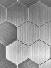 High-resolution macro shot of the brushed aluminium texture on a silver hexagon tile, showing the authentic metal grain.