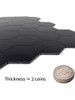 Side view of Layed Matte Black Hexagon tile showing a 4mm thickness, approximately the height of two stacked coins.