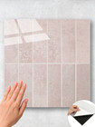 Close-up of rose pink rectangular self adhesive composite tiles showing texture and finish