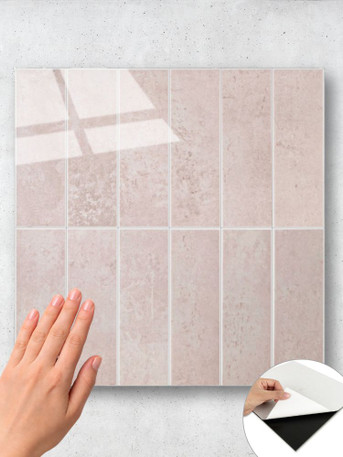Close-up of rose pink rectangular self adhesive composite tiles showing texture and finish