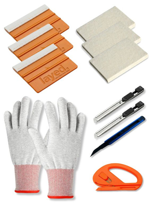 A large wrap tool kit with 3 Premium Felt Squeegees,  3 Wool Block Squeegees,  3 Retractable Knifes, Snitty Cutter and a Pair of Anti Static Wrap Gloves.