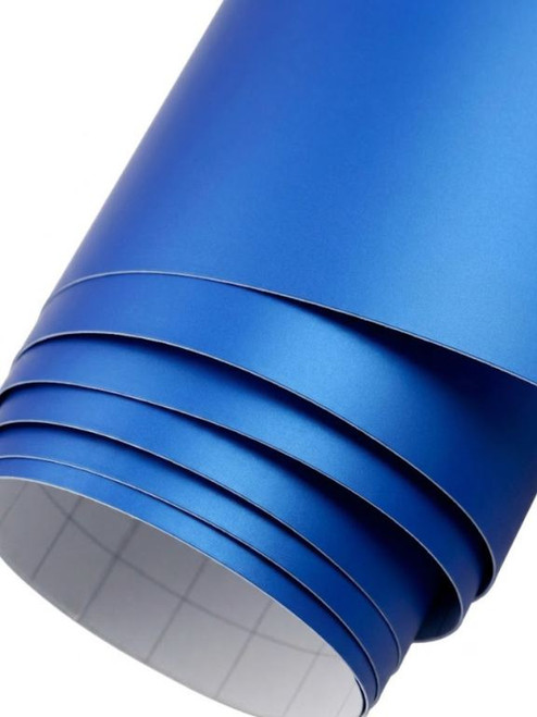 A partially unrolled roll of Layed Matte Deep Blue Vinyl Wrap M703, showcasing its smooth, non-reflective flat blue finish and the grid-lined self-adhesive backing paper.