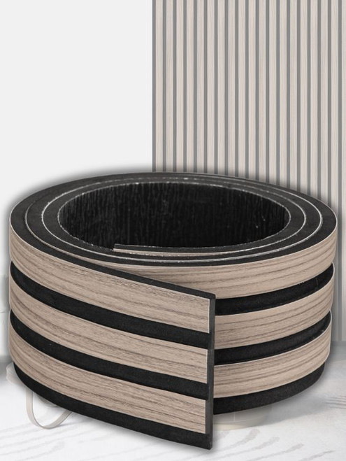 Close-up detail of the realistic washed walnut wood grain texture on the Layed fluted wall panel.