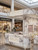 A shopping mall kiosk built and wrapped with Viola White Marble self-adhesive vinyl wrap from layed.