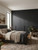 A stylish modern bedroom featuring a large built-in wardrobe finished with Premium Painted Wood Ebony Black Vinyl Wrap PPWEB32, highlighting its striking dark finish and textured wood grain aesthetic.