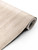 A close-up photograph of a partially unrolled Sonoma Oak Wood Vinyl Wrap SOW33 on a clean white background, highlighting its light, sandy brown color and highly realistic, subtle woodgrain texture.
