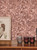 Brushed copper mosaic self-adhesive tiles installed on an accent wall behind a wooden sideboard with candle holders