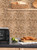 Splashback wall featuring Layed brushed brass mosaic peel and stick composite tiles