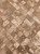 Close up of water droplets on a waterproof brushed brass mosaic peel and stick composite wall tile.