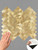 Hand touching the textured surface of a gold herringbone tile sheet, with an inset showing the easy peel-and-stick adhesive backing.