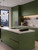 A budget-friendly DIY kitchen makeover featuring cabinets wrapped in a smooth eco matte sage green vinyl kit.