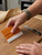 A Premium Felt Squeegee and 9mm Cutter being used for Interior Vinyl Wrap